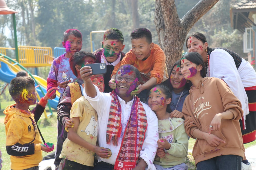 Dereje Wordofa during Holi with children at SOS Children's Village, Kavre. Photos: SOS CHILDREN'S VILLAGE NEPAL
