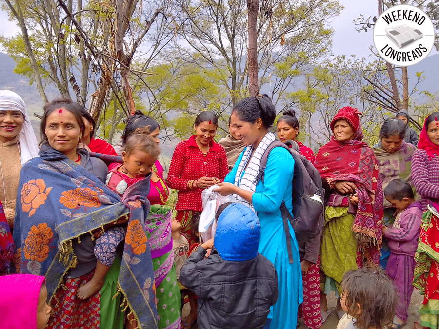 Community Health Worker Jamuna Saud distributing eggs to members of a mother's group in Patalkot village.