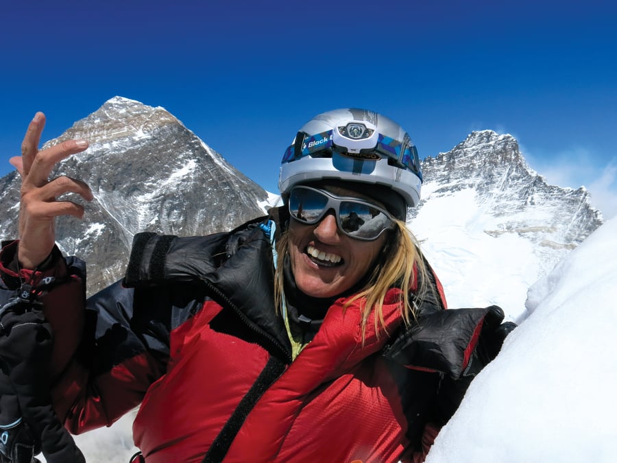Billi Bierling on the Nuptse ridge in 2013, flanked by Mt Everest and Lhotse in the background. Photo: BIERLING ARCHIVE