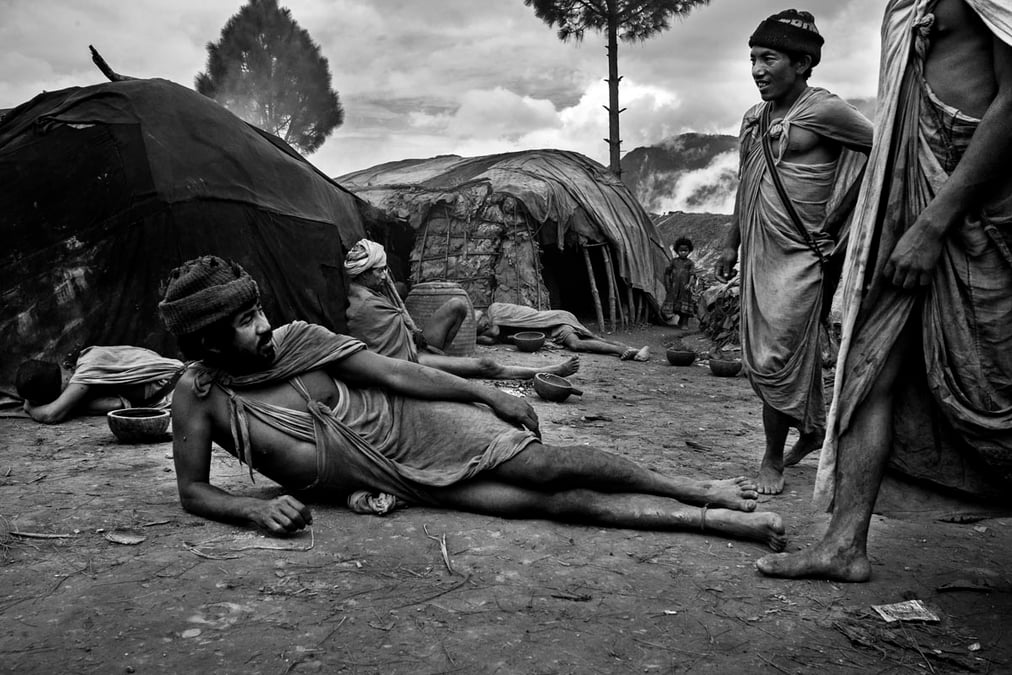 Prakash Shahi (left) with his friends in a temporary Raute settlement in Salyan district of Nepal. All photos: KISHOR SHARMA