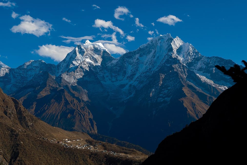 Mt Kangtega (6,782m) and Mt Thamserku (6,608m) looking south from the moraine of the Ngzumba Glacier in Gokyo. At present rates of temperature increase, climate scientists say these mountains will lose two-thirds of their remaining ice during this century. Photo: AÏSHA MACDOUGALL