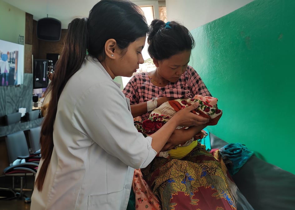 A nurse after delivering a baby in Udaypur in Nepal. Photo: NARESH NEWAR