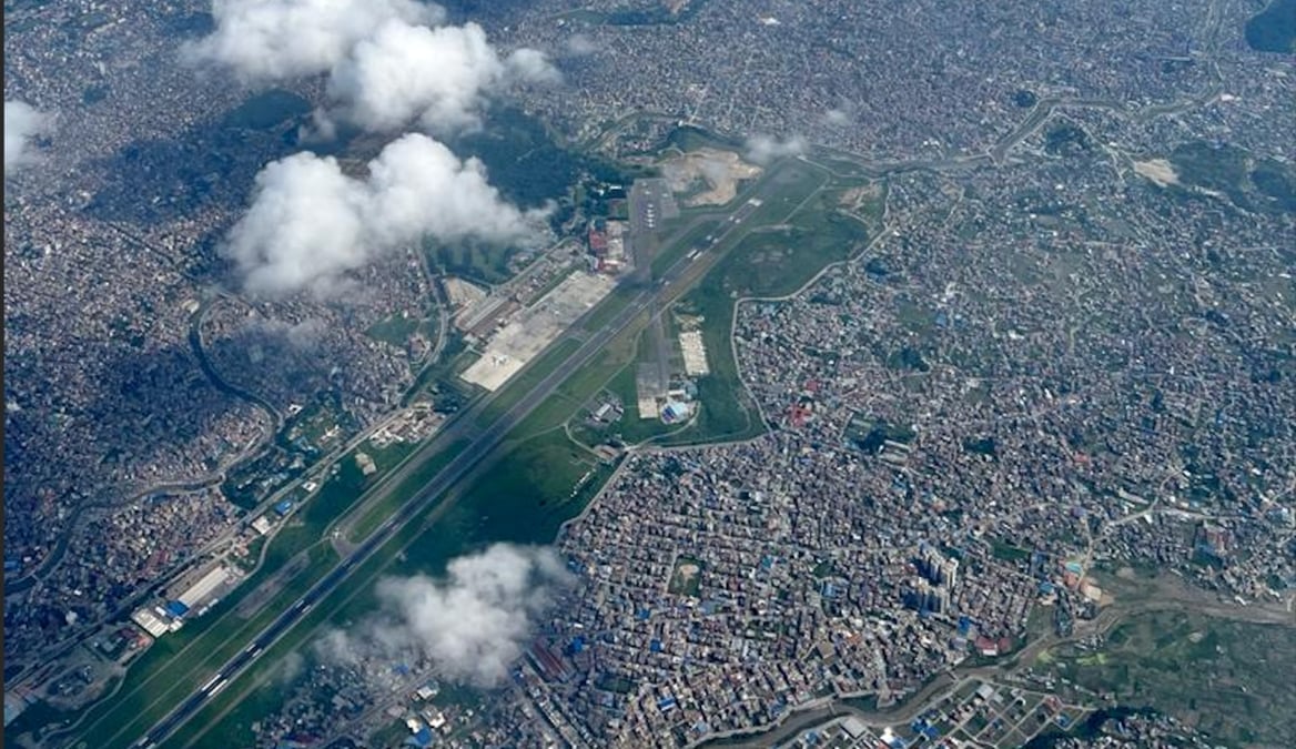 Kathmandu airport from the air. The parallel taxiway is being extended to thresholds at both ends of the runway to improve airport efficiency, but will lead to added congestion till March next year. Photo: KUNDA DIXIT
