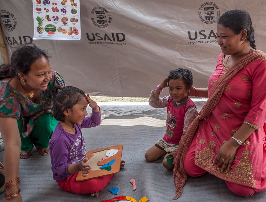 Children learn in a makeshift classroom near Bhaktapur following the 2015 Nepal earthquake. Photo: KASHISH DAS SHRESTHA/ USAID