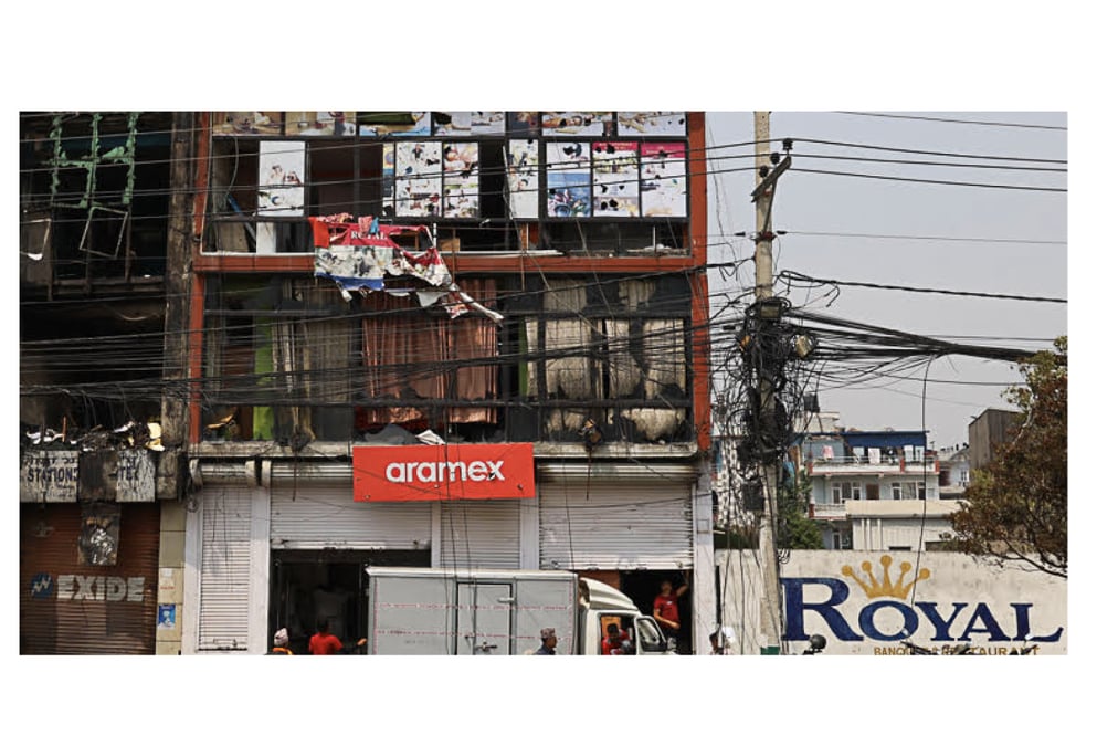 ROYAL MESS: Office buildings vandalised and set on fire at Tinkune, the building on the left is the one in which Avenues TV journalist Suresh Rajak was killed after rioters set fire to it. Photo: SUMAN NEPALI