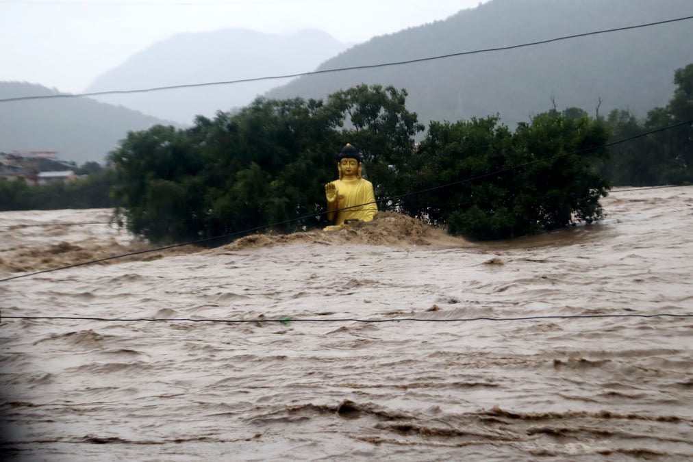 The statue of the Buddha on the banks of Narayani River in Bharatpur where the water level rose dangerously high during September floods in Nepal in 2024 that killed over 200 people. Photo: KRISHNA ACHARYA / RSS