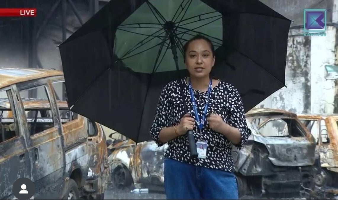 Reporter Sabina Karki presenting from outside Kantipur TV after the station was torched in the protests last week.