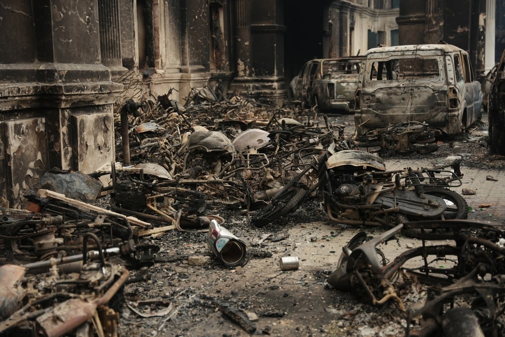 The parking area of the Department of Roads with a row of charred cars after the 9 September protest. Photos: AMIT MACHAMASI
