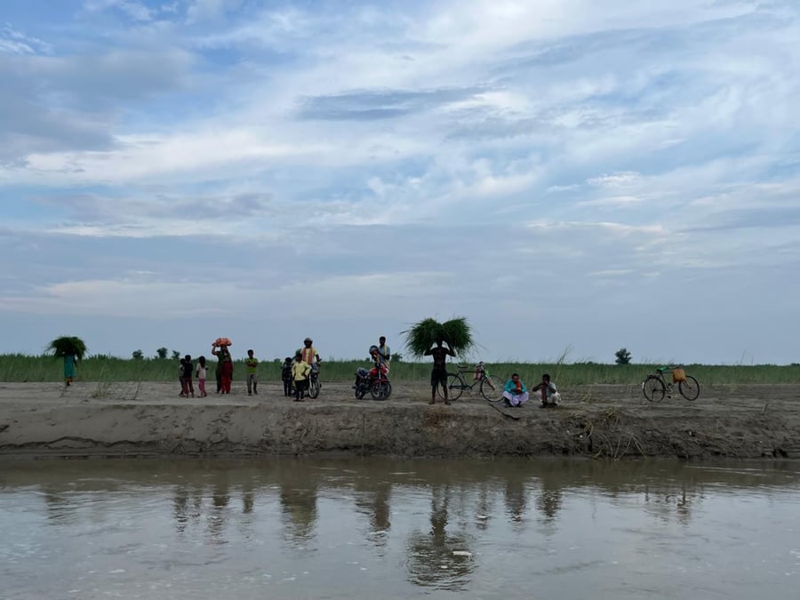 Locals waiting for the only boat to cross the Bagmati River, carrying long grass for livestock or bikes for transport. Photos: ANEK RAJBHANDARI