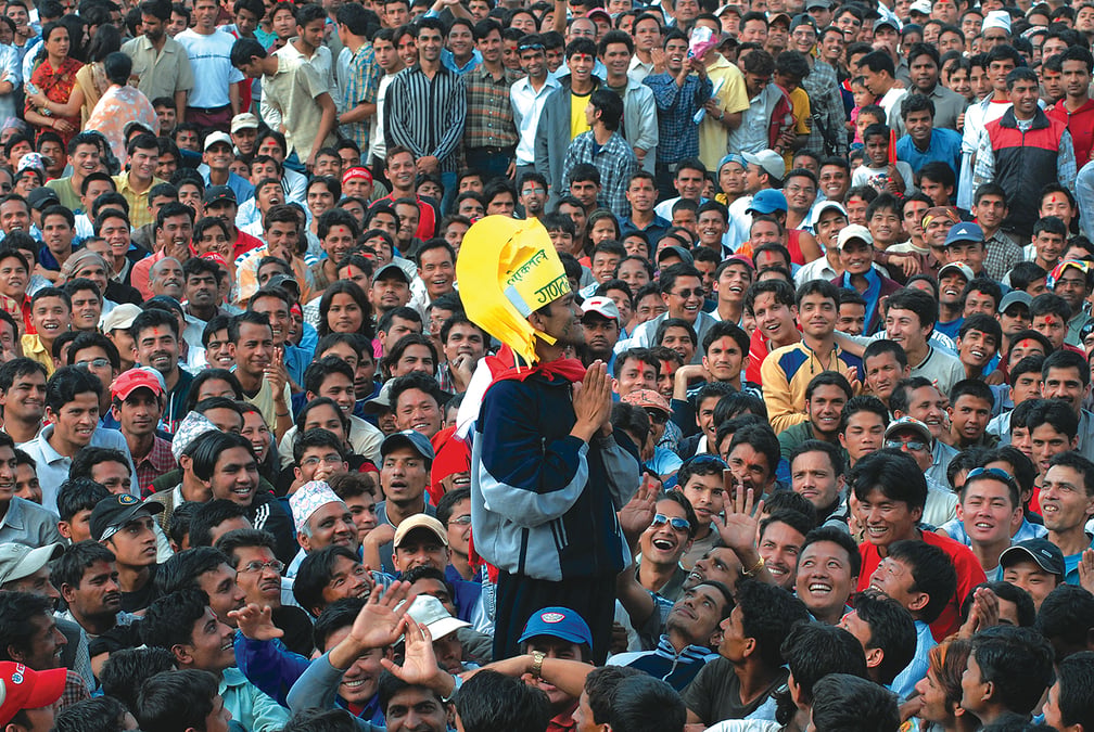 A student protester wearing a paper crown and ridiculing Gyanendra with an impersonation, a day after king stepped down and left his palace. Photo: AJAY JOSHI / A PEOPLE WAR
