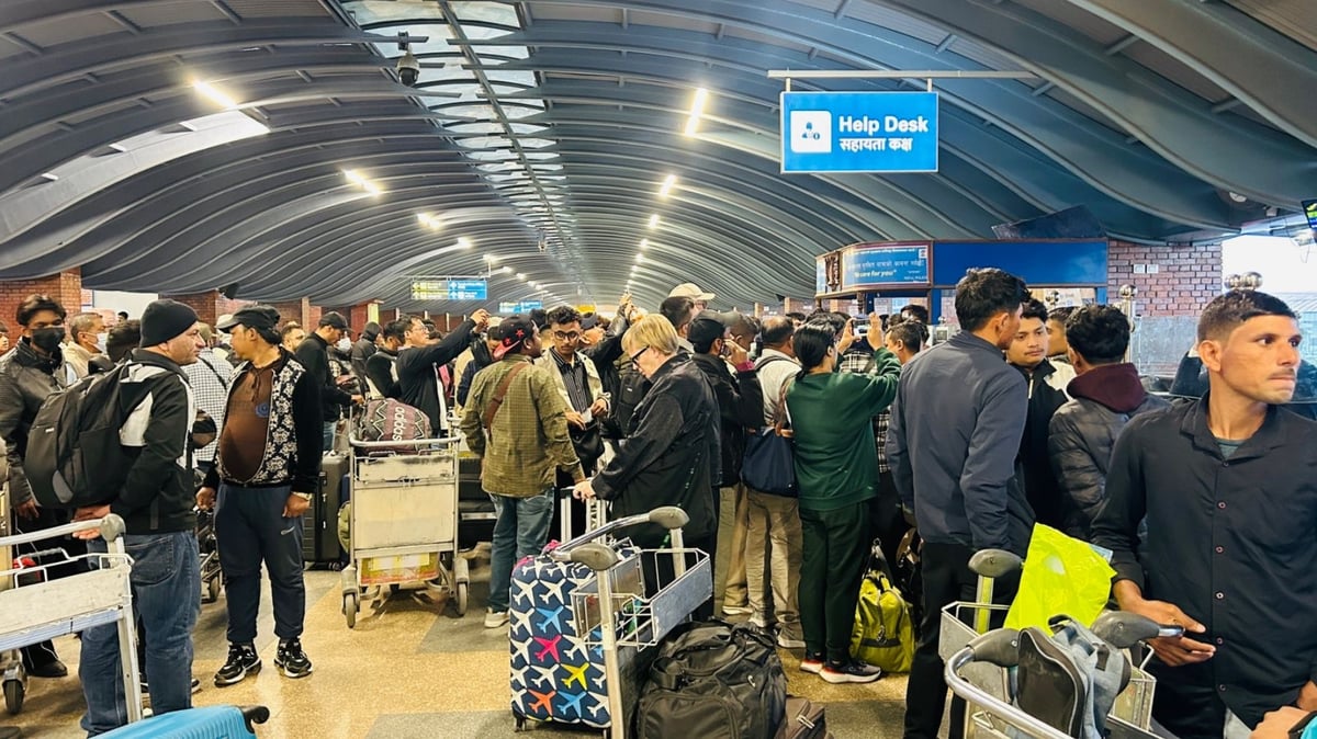 Passengers at Kathmandu airport waiting for flights on Saturday evening.