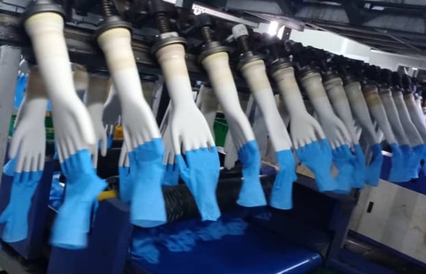 Global glove makers compensate Nepali workers
