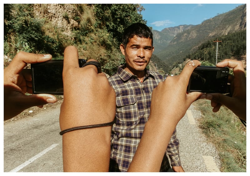 This person was very happy because we were taking his photos, so I took his photo. Dhan, 13